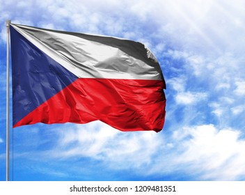National flag of Czech Republic on a flagpole in front of blue sky