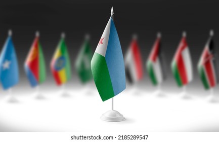 The national flag of the Djibouti on the background of flags of other countries