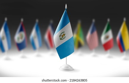 The national flag of the Guatemala on the background of flags of other countries