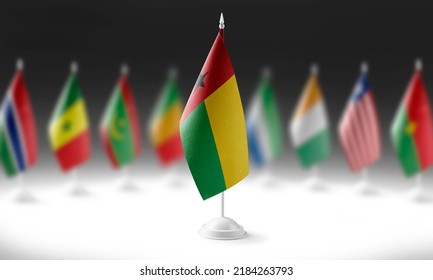 The national flag of the Guinea Bissau on the background of flags of other countries