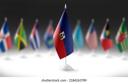 The national flag of the Haiti on the background of flags of other countries
