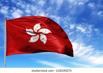 National flag of Hong Kong on a flagpole in front of blue sky