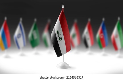The national flag of the Iraq on the background of flags of other countries
