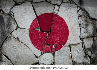 National Flag Of Japan
 Depicting In Paint Colors On An Old Stone Wall. Flag  Banner On Broken  Wall Background.