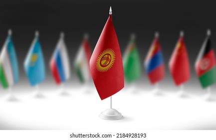 The national flag of the Kirghizia on the background of flags of other countries