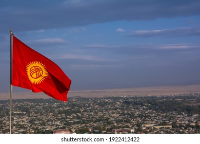 National Flag Of Kyrgyzstan On The Background Of The City Of Osh