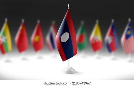 The national flag of the Laos on the background of flags of other countries