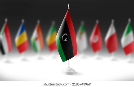 The national flag of the Libya on the background of flags of other countries