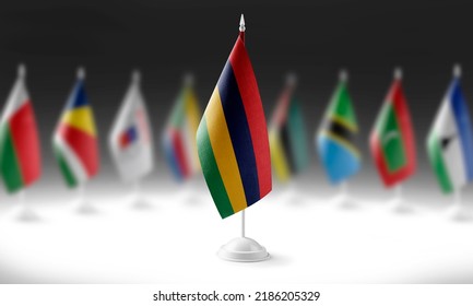 The national flag of the Mauritius on the background of flags of other countries