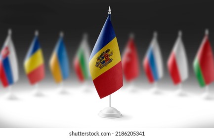 The national flag of the Moldavia on the background of flags of other countries
