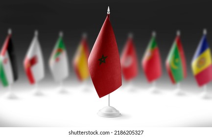 The national flag of the Morocco on the background of flags of other countries