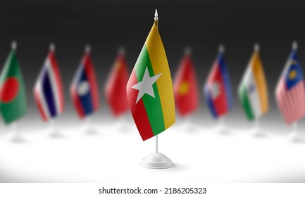 The national flag of the Myanmar on the background of flags of other countries
