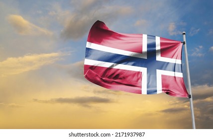 The national flag of Norway is red with a navy blue Scandinavian cross fimbriated in white that extends to the edges of the flag; the vertical part of the cross is shifted to the hoist side in the sty