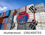 The national flag of South Korea on a large number of metal containers for storing goods stacked in rows on top of each other. Conception of storage of goods by importers, exporters