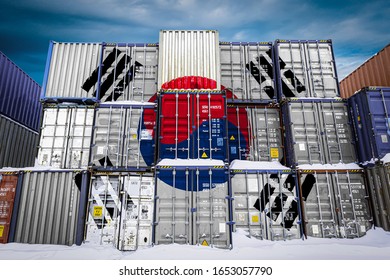 The national flag of South Korea on a large number of metal containers for storing goods stacked in rows on top of each other. Conception of storage of goods by importers, exporters - Shutterstock ID 1653057790