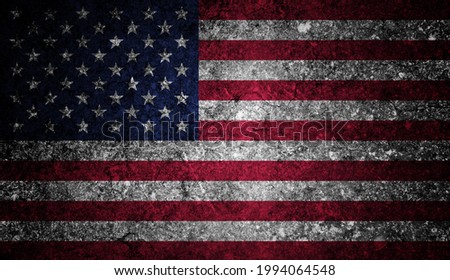National flag of USA depicting in paint colors on an old stone wall. Flag banner on broken wall background.
