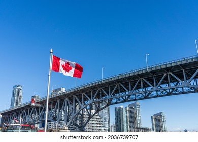 National Flags Of Canada And Granville Bridge. Vancouver City Skyscrapers Skyline In The Background. Concept Of Canadian Urban City Life.