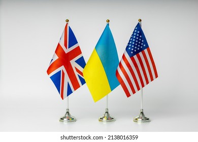 National flags of Great Britain, USA and Ukraine on a light background.