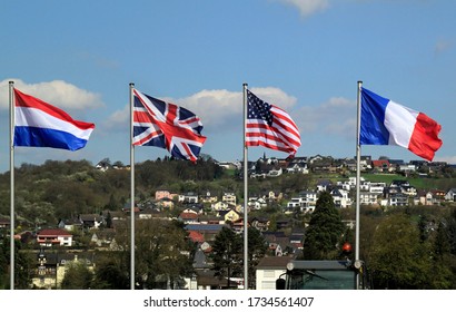 The national flags of the Netherlands, UK, USA, and France at the bridge of Remagen, Germany, where the Allies crossed the river Rhine - Shutterstock ID 1734561407