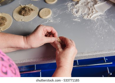 National Georgian Cuisine Khinkali. Senior Woman Prepares Khinkali. Top View Raw Meat Dough Dish Uncooked. Process Cooking