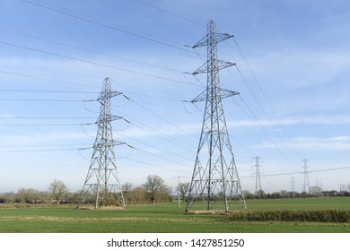 National Grid Electricity Pylons And Overhead Power Lines Cross Countryside In Rural Buckinghamshire, England, UK