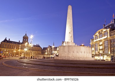 The National Monument on the Dam and in the background the Royal Palace in Amsterdam the Netherlands at twilight