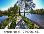 Petkeljärvi National Park, Ilomantsi, Eastern Finland. Wooden bridge and lake.