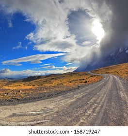 National Park Torres del Paine in Chile. Awesome cloud over a gravel road. The picture was taken Fisheye lens