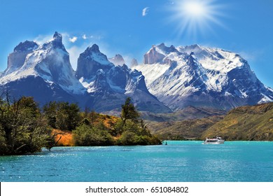  National Park Torres del Paine, Chile.  Azure Lake Pehoe at the foot of the magnificent snow-covered cliffs of Los Kuernos