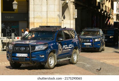 National Police (Policia) Of Spain With Toyota Land Cruiser SUV Cars In Plaza Mayor From Madrid, 2022. Law Enforcement.