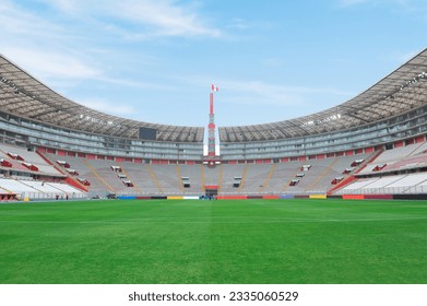 National stadium in Lima, Peru. Peruvian soccer stadium in Lima. Stadium for musical concerts and soccer. Empty stadium during the day, with a Peruvian flag. - Shutterstock ID 2335060529