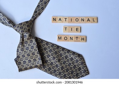 National Tie Month text on wood, isolated at white background - Powered by Shutterstock