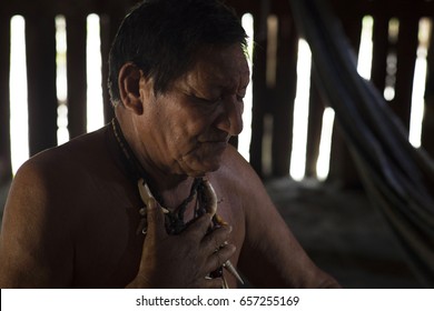 Native Amazonian Man, Cacique Of An Indigenous Tribe In His Hut (Leticia, The Colombian Amazon)