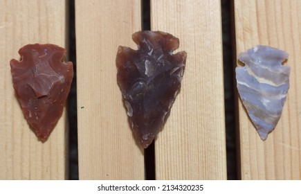 Native American Arrowhead Collection On Wooden Display