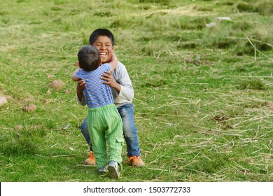 Native American Boy Hugging His Little Brother.