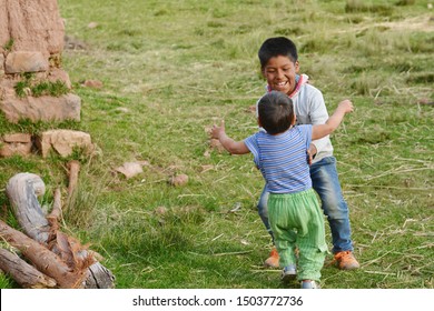 Native American Boy Hugging His Little Brother.