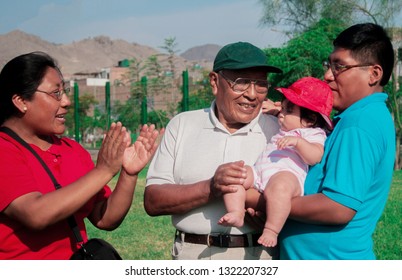 Native American Family Of Three Generations Having Good Time In The Summer Park.