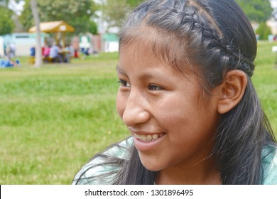 Native American Girl Laughing Outside.