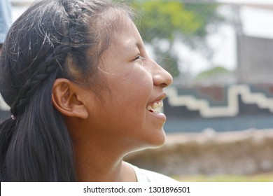 Native American Girl Laughing Outside.