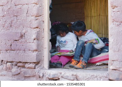 Native American Kids Reading A  Book.