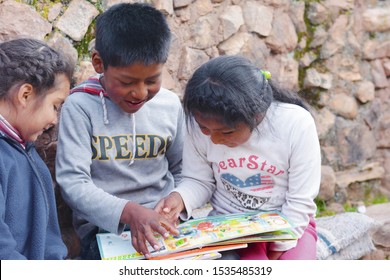 Native American Kids Reading A  Book.