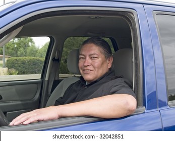 Native American Man In His Blue Car