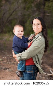 Native American Mother And Her Mixed Race Baby Boy Enjoying A Day In The Nature