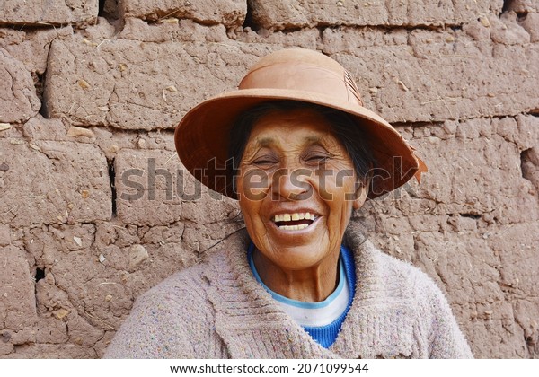 Native american\
old woman in the\
countryside.