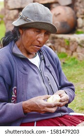 Native American Old Woman Eating Potato.