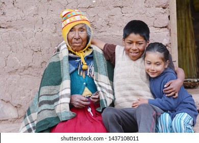 Native american old woman with her grandchildren.
