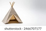 Native American people  concept paper origami isolated on white background of a tipi or teepee  conical lodge tent, home or house, with copy space, simple starter craft for kids