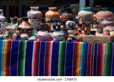 Native American Pottery On Colorful Display Table