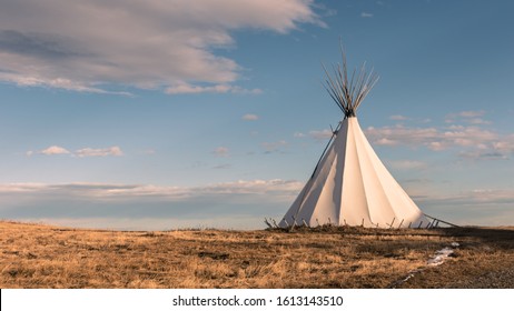 Native American Teepee in the Grassy Plains at Sunset - Powered by Shutterstock