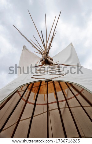 Native American teepee, looking up to the sky.